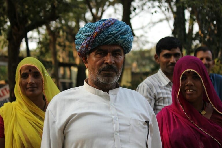 Portrait of people in traditional Indian clothing outdoors, showcasing cultural attire.